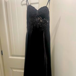 Black strapless formal gown with lace corset bodice and lace up back